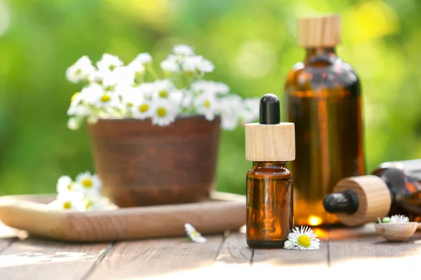 Bottles Chamomile Essential Oil Flowers Wooden Table Space Text — Stock Photo, Image