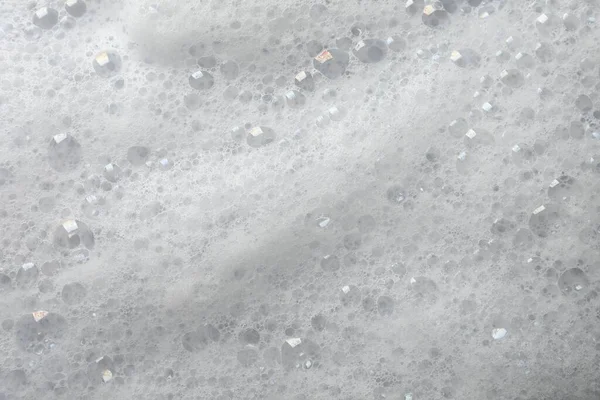 ふわふわの石鹸泡を背景として クローズアップビュー — ストック写真