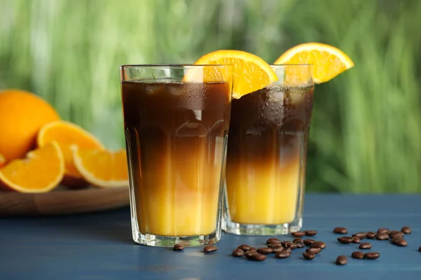 Tasty Refreshing Drink Coffee Orange Juice Blue Wooden Table Blurred — Fotografia de Stock