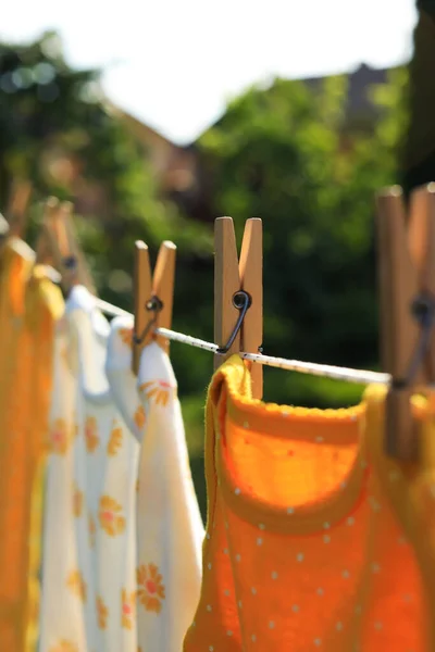 Clean Baby Onesies Hanging Washing Line Garden Closeup Drying Clothes — Stockfoto