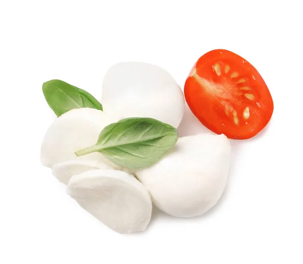 stock image Delicious mozzarella, tomato and basil leaves on white background, top view