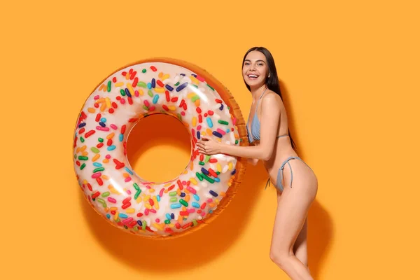 Young Woman Inflatable Ring Orange Background — Stock Photo, Image