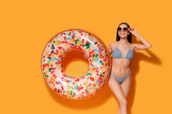 Young Woman Stylish Sunglasses Holding Inflatable Ring Orange Background — Stock Photo, Image