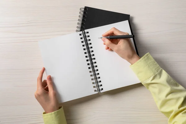 Mujer Escribiendo Cuaderno Mesa Madera Blanca Vista Superior —  Fotos de Stock