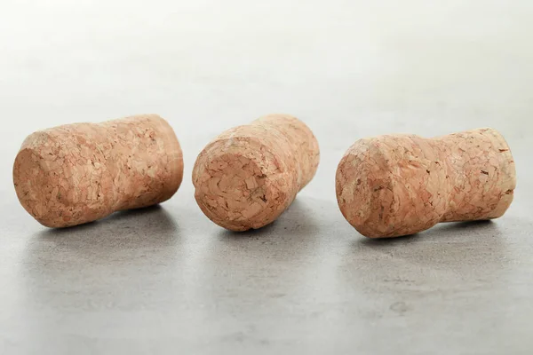 stock image Corks of wine bottles on light grey table, closeup