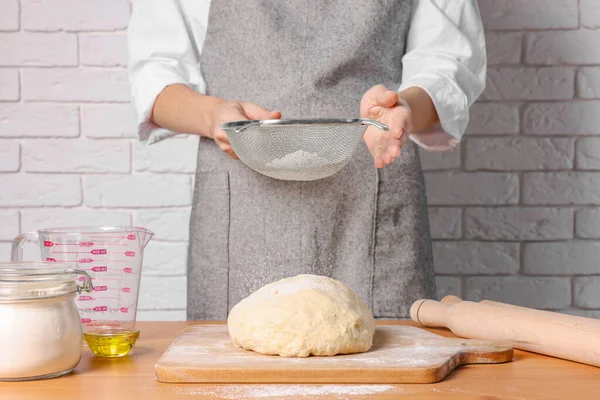 Woman Sprinkling Flour Dough Table White Brick Wall Closeup — Stock Photo, Image