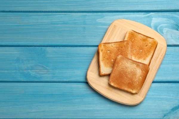 Slices Tasty Toasted Bread Turquoise Wooden Table Top View Space — Stock Photo, Image