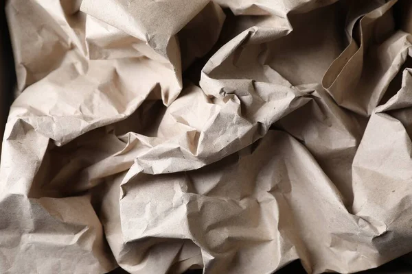 Crumpled waste paper as background, top view