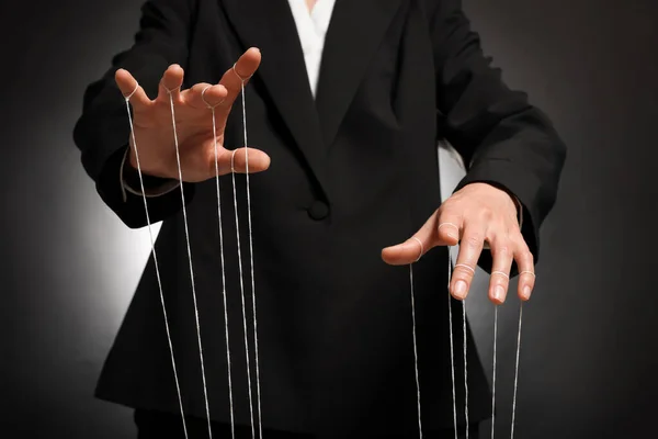 Woman Suit Pulling Strings Puppet Dark Background Closeup — Stock Photo, Image