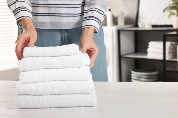 Woman Stacking Clean Towels White Table Laundry Room Closeup Space — Stock Photo, Image