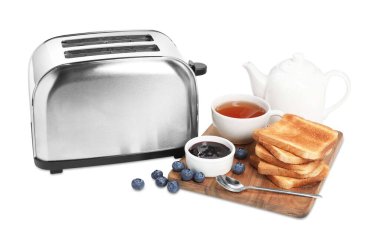 Toaster, bread with jam, blueberries and tea on white background