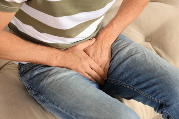 Man Suffering Genital Herpes Sofa Closeup — Stock Photo, Image