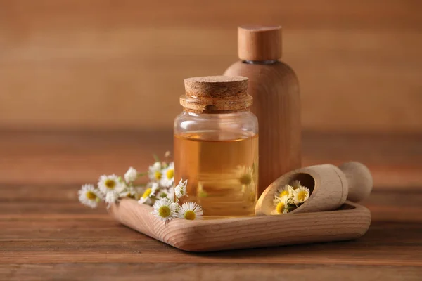 Bottles Chamomile Essential Oil Flowers Wooden Table — Fotografia de Stock