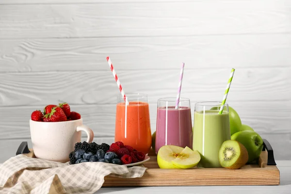 Glasses Different Tasty Smoothies Fresh Ingredients White Wooden Table — Stock Photo, Image