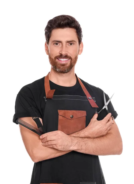 stock image Smiling hairdresser holding combs and scissors on white background