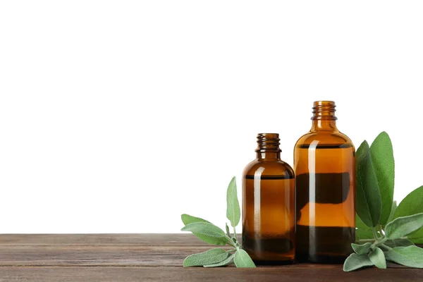 Bottles Essential Oil Sage Wooden Table White Background — Stock Photo, Image