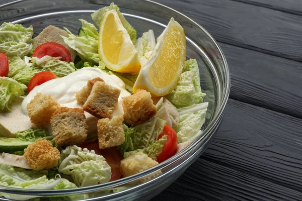 Bowl Delicious Salad Chinese Cabbage Lemon Tomatoes Bread Croutons Black — Stock Photo, Image