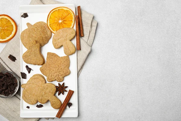 stock image Flat lay composition with baked biscuits of different shapes on light table. Space for text