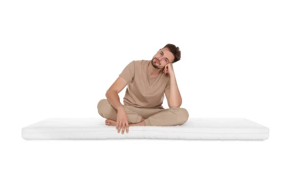Man Sitting Soft Mattress White Background — Stock Photo, Image