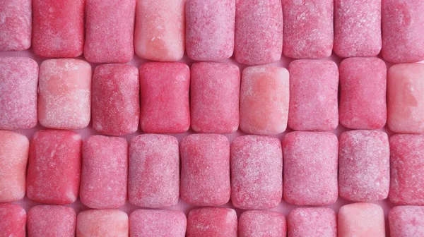 许多粉红的咀嚼牙龈作为背景 顶视图 — 图库照片