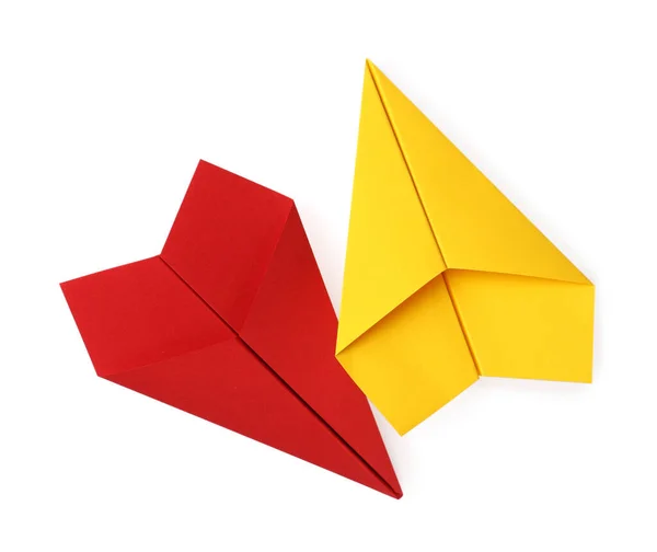 手工制作的黄色和红色纸飞机隔离在白色的顶部视图 — 图库照片