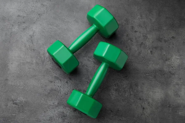Two Green Dumbbells Grey Table Flat Lay — Stock Photo, Image