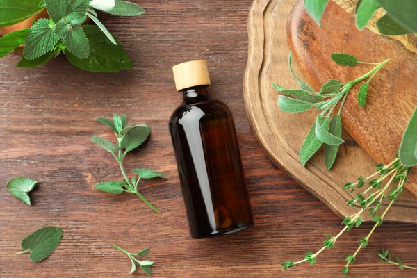 Bottle Essential Oil Fresh Herbs Wooden Table Flat Lay — Stock Photo, Image