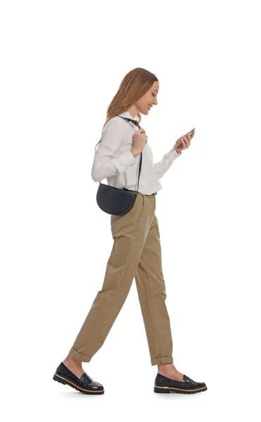 Young Woman Using Smartphone While Walking White Background — Stock Photo, Image