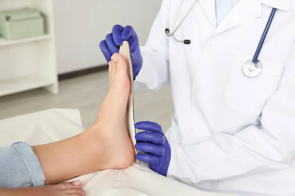 Male Orthopedist Fitting Insole Patient Foot Hospital Closeup — Stock Photo, Image