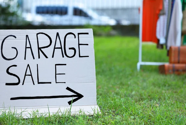 stock image Sign Garage sale written on cardboard in yard. Space for text