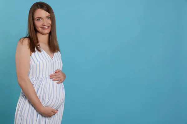 Happy Young Pregnant Woman Light Blue Background Space Text — Zdjęcie stockowe