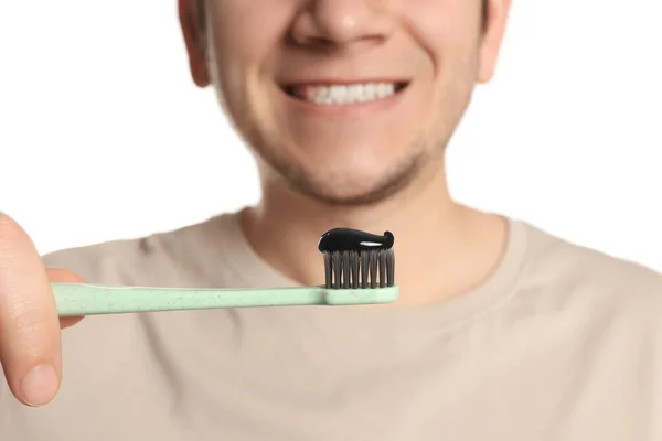 Man Holding Toothbrush Charcoal Toothpaste White Background Closeup — Stock Photo, Image