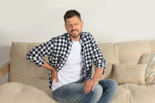 Man Suffering Pain Back Sofa Home — Stock Photo, Image