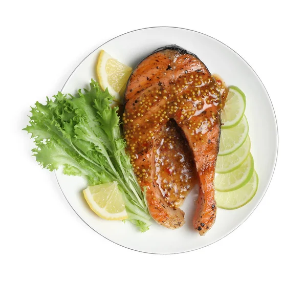 Tasty salmon steak with sauce, citrus slices and lettuce on white background, top view