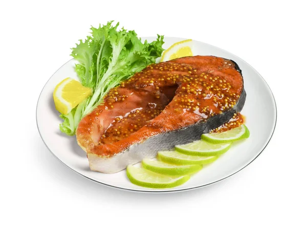 Tasty salmon steak with sauce, citrus slices and lettuce on white background