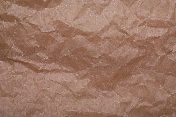 背景としての砕いた茶色のベーキングペーパーの質感 トップビュー — ストック写真
