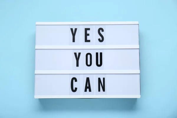 Lightbox Phrase Yes You Can Light Blue Background Top View — стоковое фото
