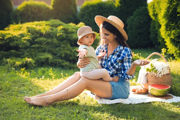 stock image Mother with her baby daughter having picnic in garden on sunny day