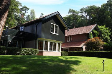 Picturesque view of beautiful house and plants on sunny day
