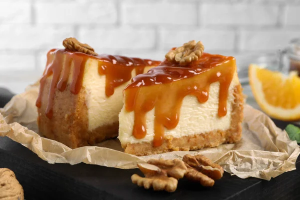 Pieces Delicious Caramel Cheesecake Walnuts Table Closeup — Stock Photo, Image