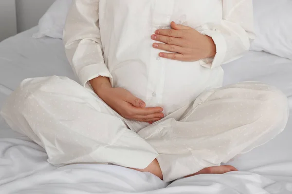 Pregnant Woman Pajamas Bed Home Closeup — Stockfoto