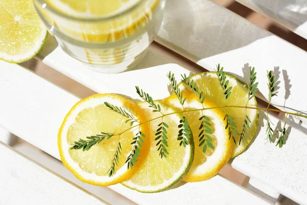 Delicious Refreshing Lemonade Pieces Citrus White Wooden Table Outdoors Flat — Stock Photo, Image
