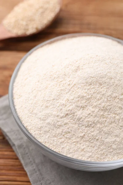 stock image Glass bowl with quinoa flour on table, closeup