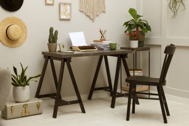 Typewriter and stack of papers on dark table in room. Writer's workplace