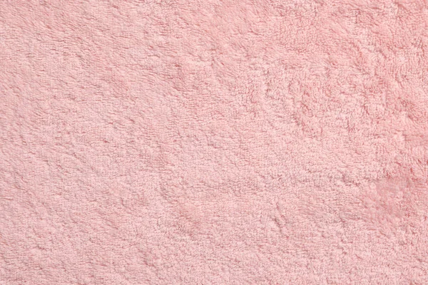 柔らかいピンクのタオルを背景として トップビュー — ストック写真