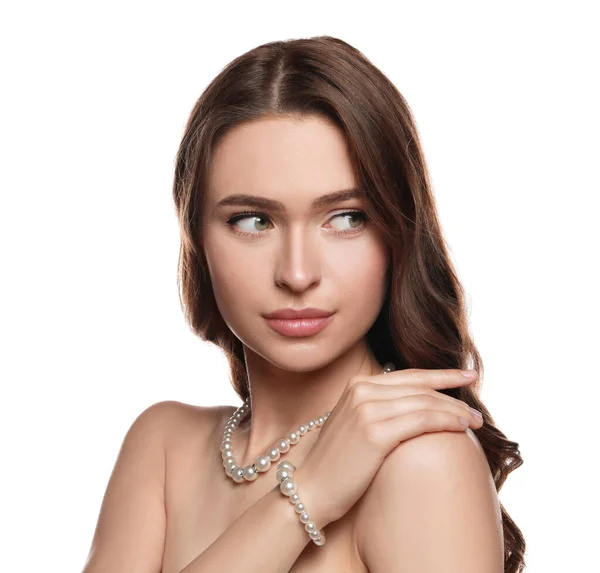 stock image Young woman wearing elegant pearl jewelry on white background