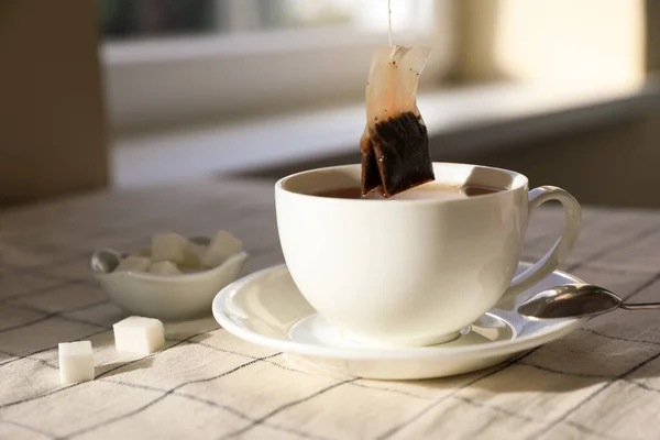 Taking Tea Bag Out Cup Table Indoors Closeup — Stock Photo, Image