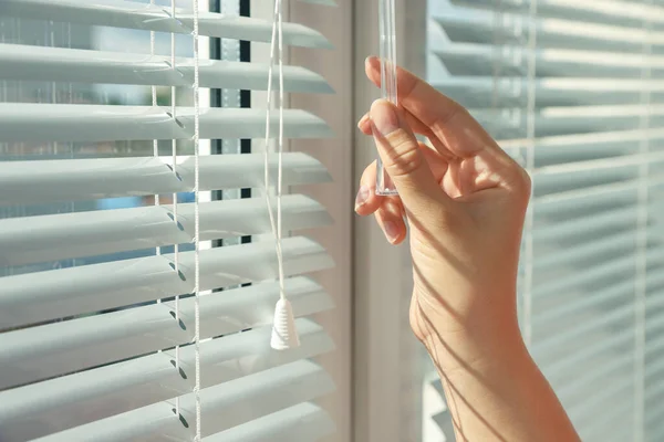 Woman Opening Horizontal Blinds Window Indoors Closeup — Photo