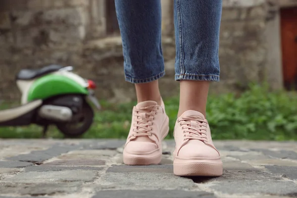 stock image Woman in stylish sneakers walking on city street, closeup