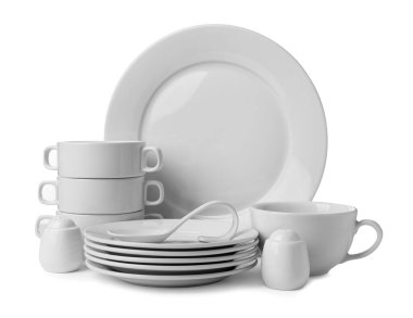 Set of clean dishware isolated on white clipart